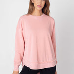 Women's light pink Relaxed Burnout fleece Sweatshirt with crew neck, dropped shoulders and hi-lo curved hem