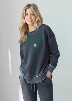 Oregon Ducks Women's Charcoal Relaxed Burnout fleece Sweatshirt with crew neck, dropped shoulders and hi-lo curved hem