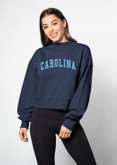 North Carolina Tar Heels Women's Navy Relaxed, waist-length Heavyweight Fleece Sweatshirt with mock neck, drop shoulders and balloon sleeves