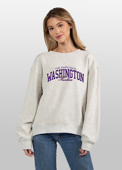 Washington Huskies Women's Ash-Grey Relaxed Heavyweight Fleece Sweatshirt with Dropped shoulders, crew neckline, back center seam and ribbed neckline, cuffs and hem