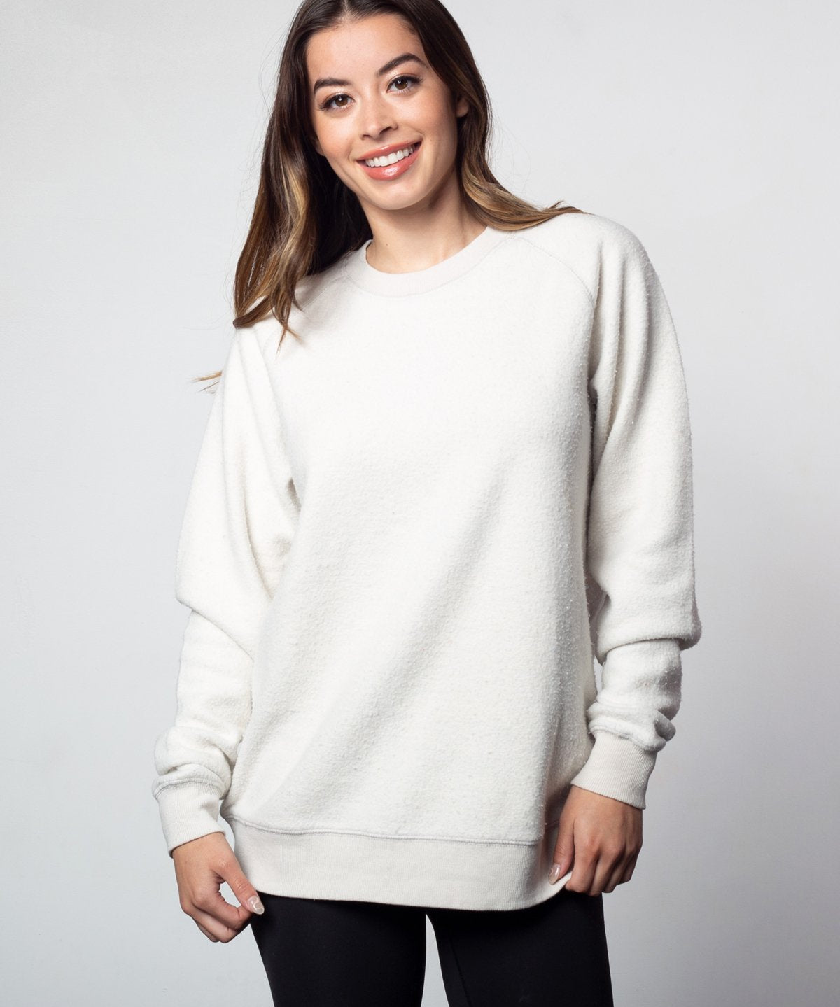 White womens crew sweatshirt with ribbed crew neck, raglan sleeves and hem.