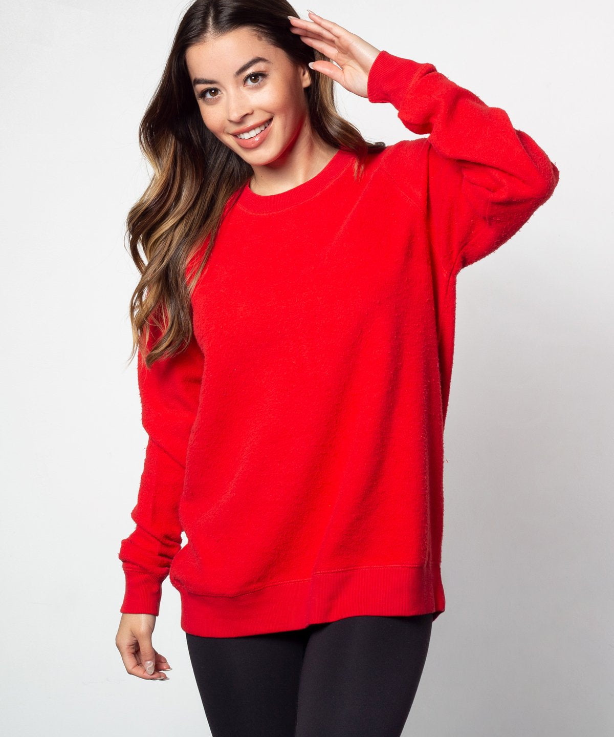 Red womens crew sweatshirt with ribbed crew neck, raglan sleeves and hem.