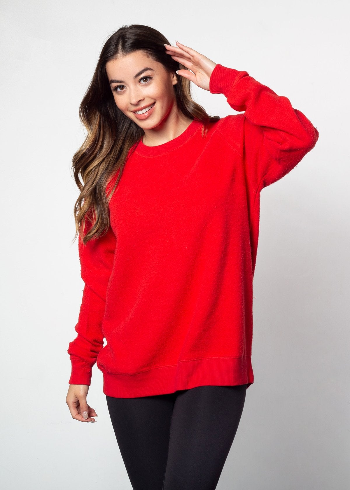 Red womens crew sweatshirt with ribbed crew neck, raglan sleeves and hem.