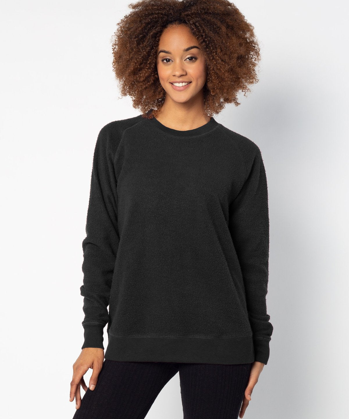 Black womens crew sweatshirt with ribbed crew neck, raglan sleeves and hem.