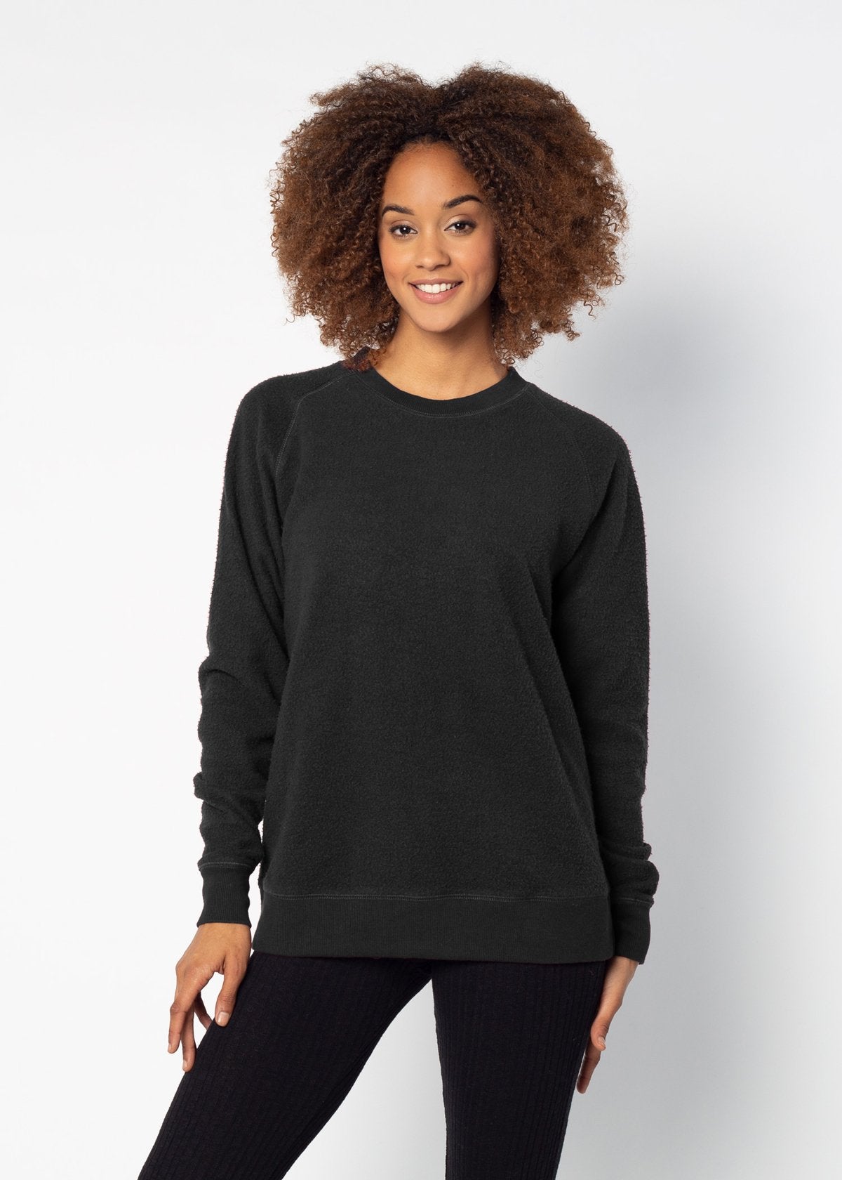 Black womens crew sweatshirt with ribbed crew neck, raglan sleeves and hem.