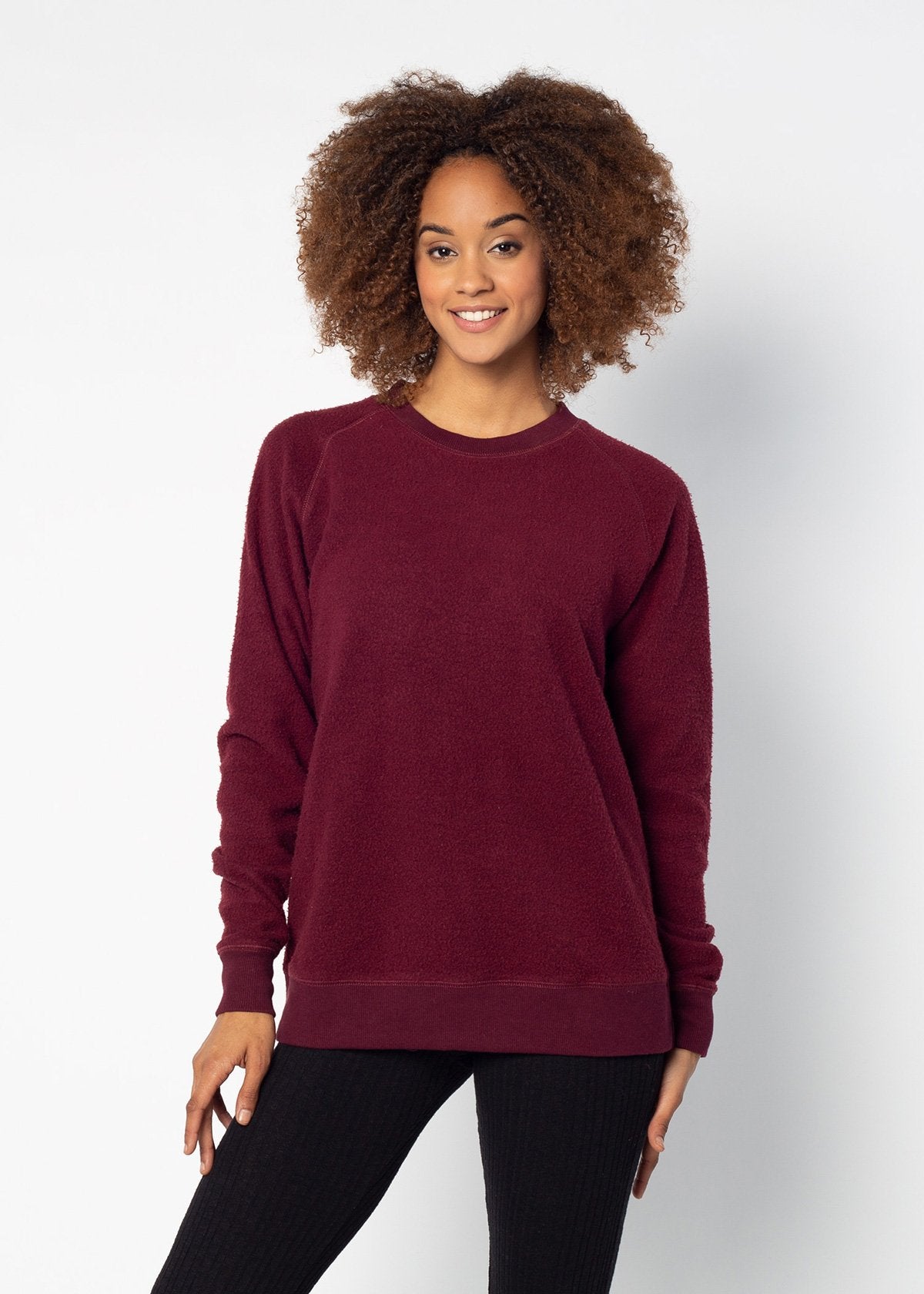 Maroon womens crew sweatshirt with ribbed crew neck, raglan sleeves and hem.