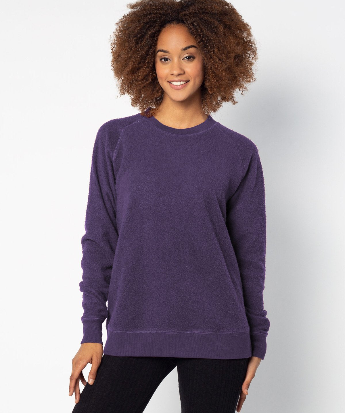 Purple womens crew sweatshirt with ribbed crew neck, raglan sleeves and hem.