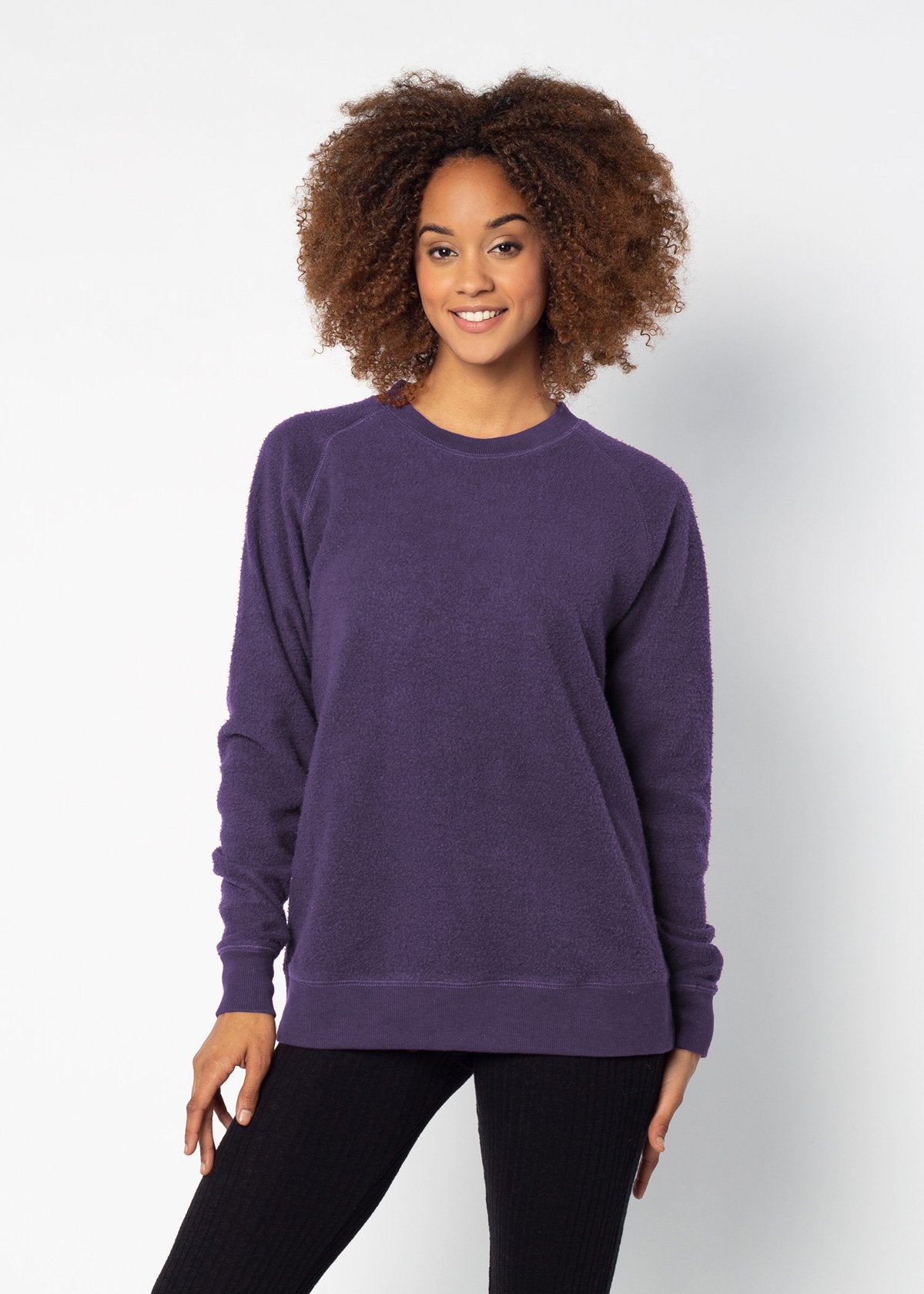 Purple womens crew sweatshirt with ribbed crew neck, raglan sleeves and hem.
